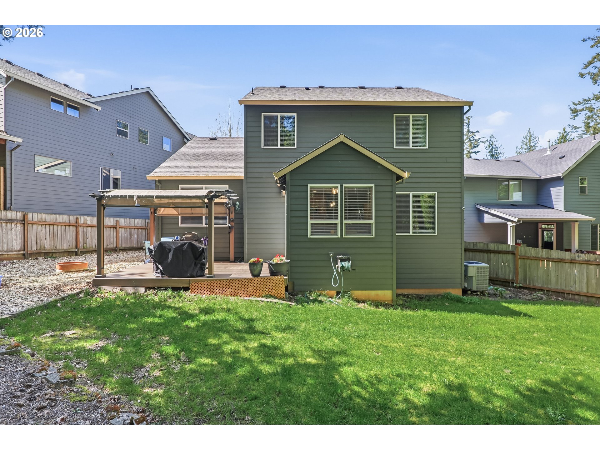 17376 Aubin Street Sandy, OR 97055 - Photo 20 of 21 a front view of a house with a yard and garage