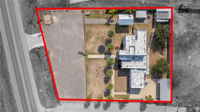 a view of a house with swimming pool and sitting area