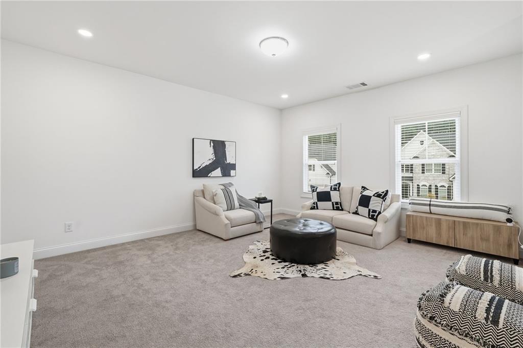 3180 Andover Street Cumming, GA 30028 - Photo 17 of 41 a living room with furniture and a window