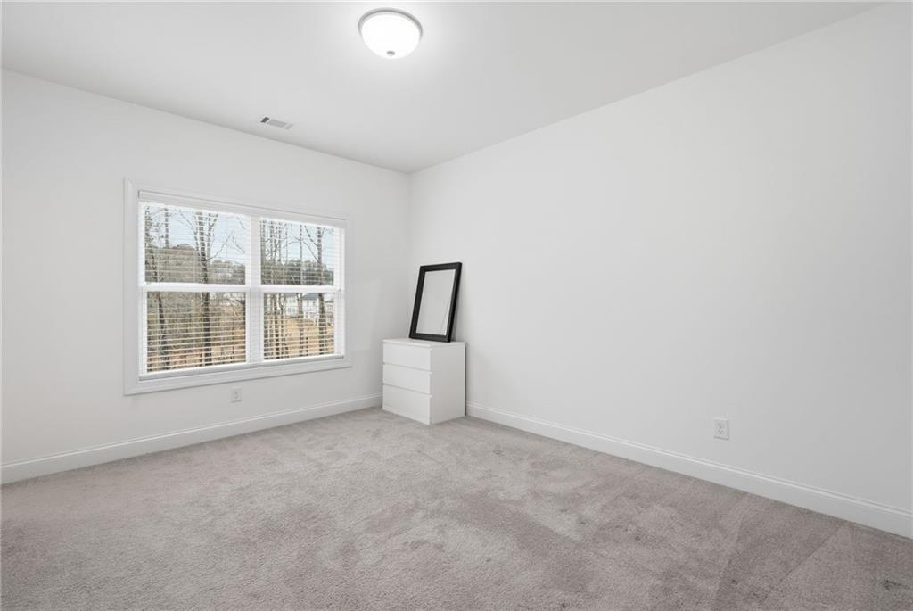 3180 Andover Street Cumming, GA 30028 - Photo 19 of 41 an empty room with windows