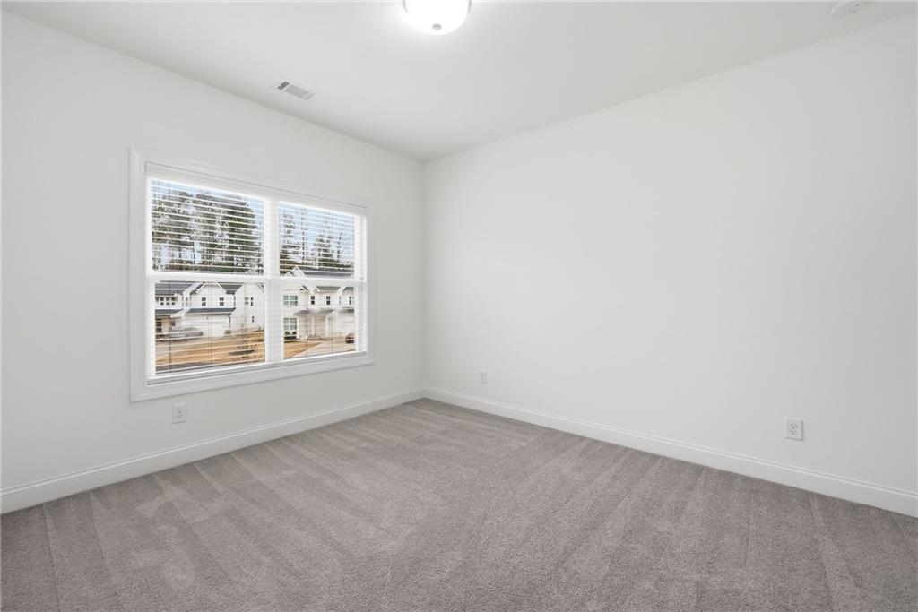 3180 Andover Street Cumming, GA 30028 - Photo 26 of 41 an empty room with a window