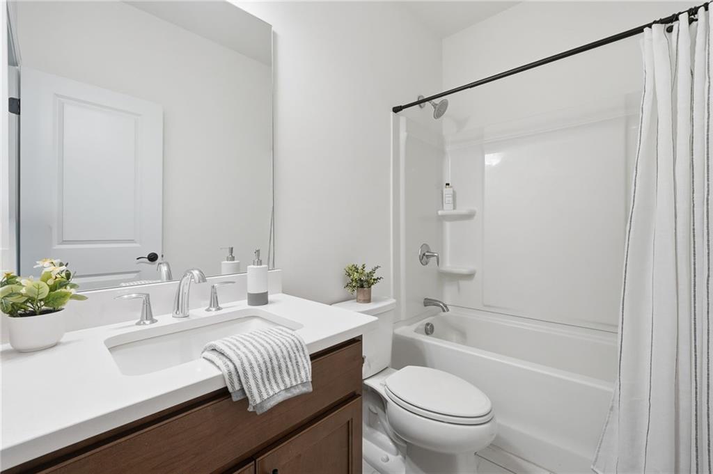3180 Andover Street Cumming, GA 30028 - Photo 27 of 41 a bathroom with a sink toilet and shower