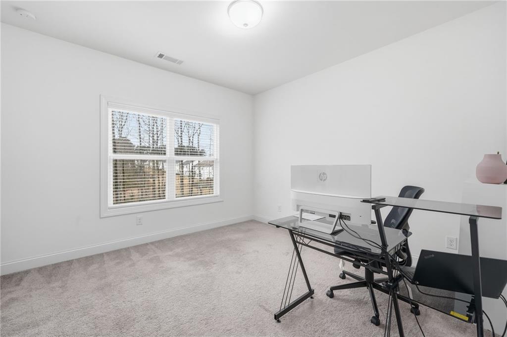 3180 Andover Street Cumming, GA 30028 - Photo 28 of 41 a workspace with furniture and a window