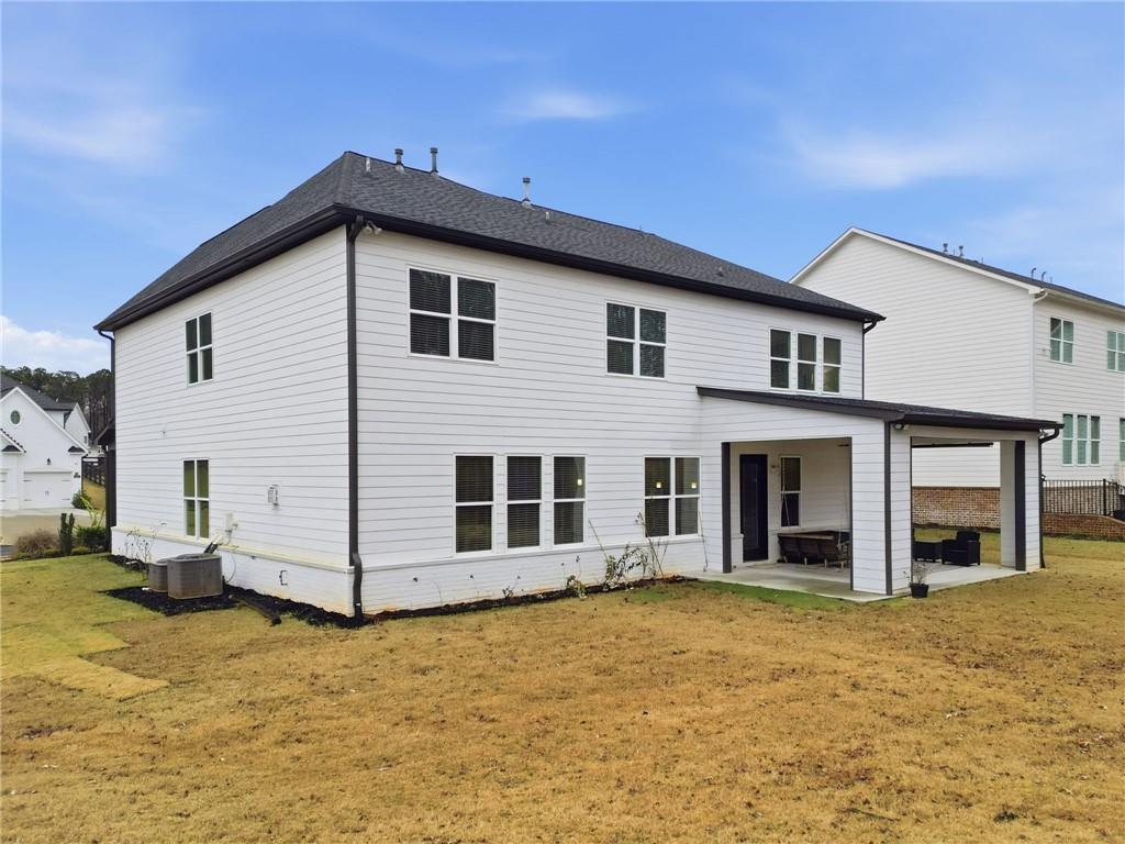 3180 Andover Street Cumming, GA 30028 - Photo 33 of 41 a view of a house with a yard