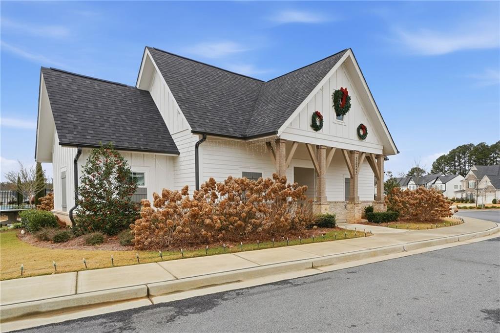 3180 Andover Street Cumming, GA 30028 - Photo 37 of 41 a front view of a house with garden