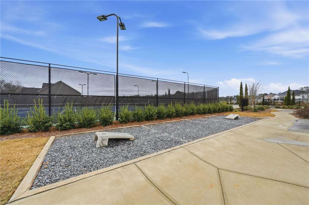 3180 Andover Street Cumming, GA 30028 - Photo 40 of 41 a view of a street with a building in the background