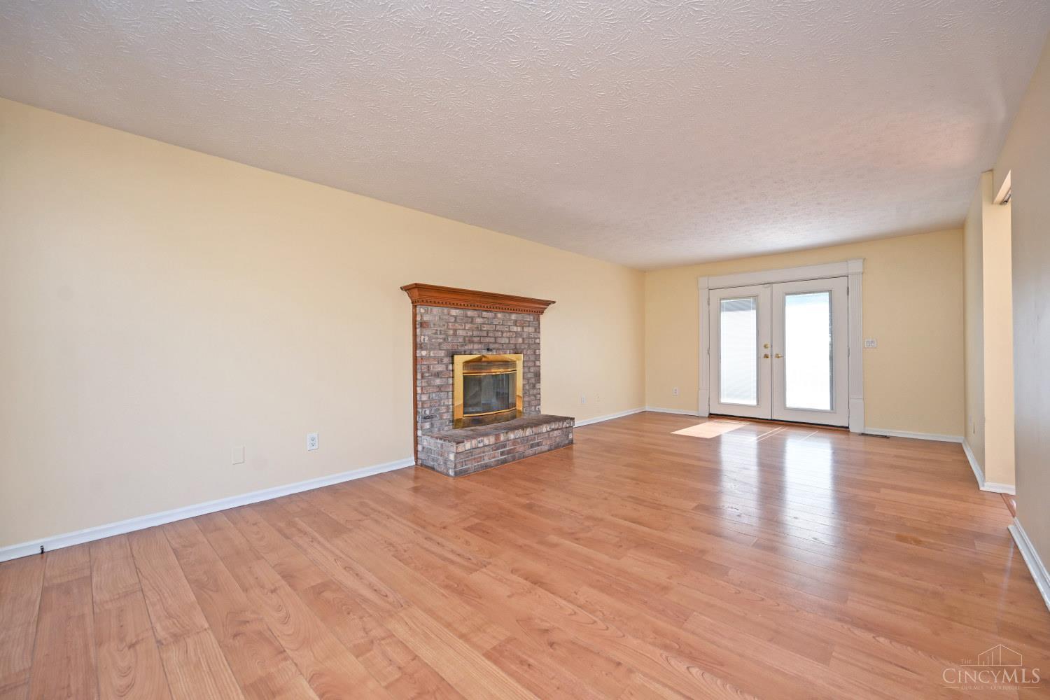 7853 West Chester Road West Chester, OH 45069 - Photo 6 of 54 Living room 13'1"x 24'7" features laminate flooring and a walk out to the back decking.