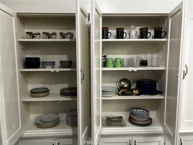 a kitchen with a refrigerator and a stove