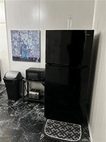 a living room with chairs and a table