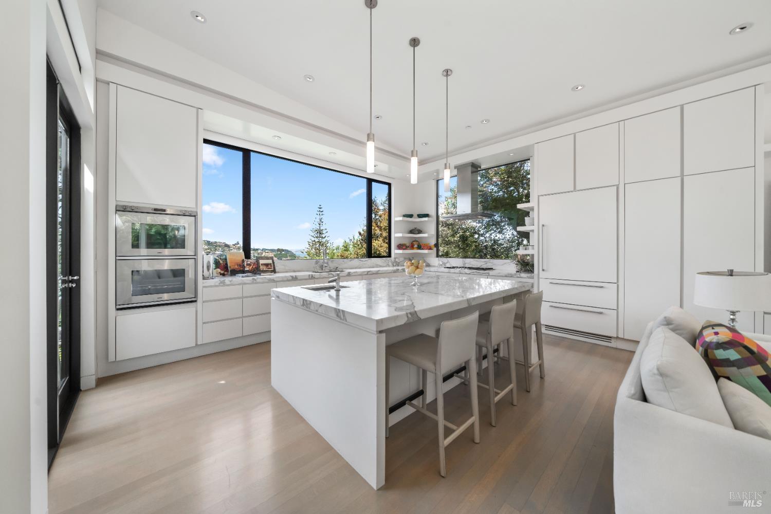 408 Golden Gate Avenue Belvedere, CA 94920 - Photo 29 of 71 a kitchen with kitchen island granite countertop a sink a counter top space appliances and cabinets