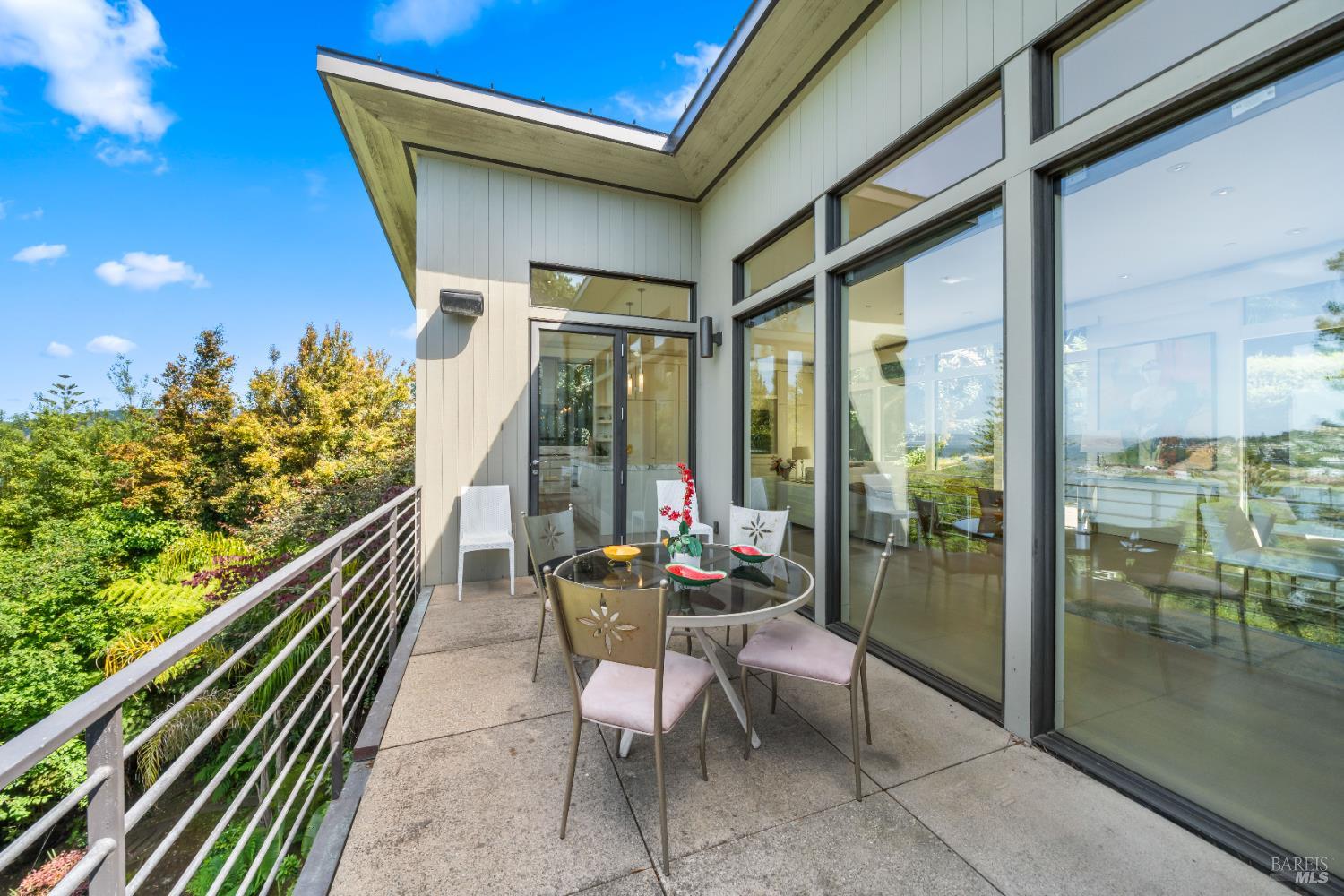 408 Golden Gate Avenue Belvedere, CA 94920 - Photo 37 of 71 a balcony with chairs and table