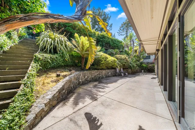 a bathroom with a double vanity sink and a toilet