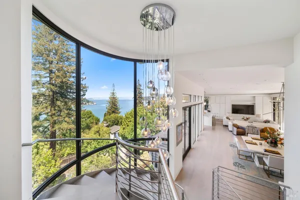 a view of a living room and floor to ceiling window