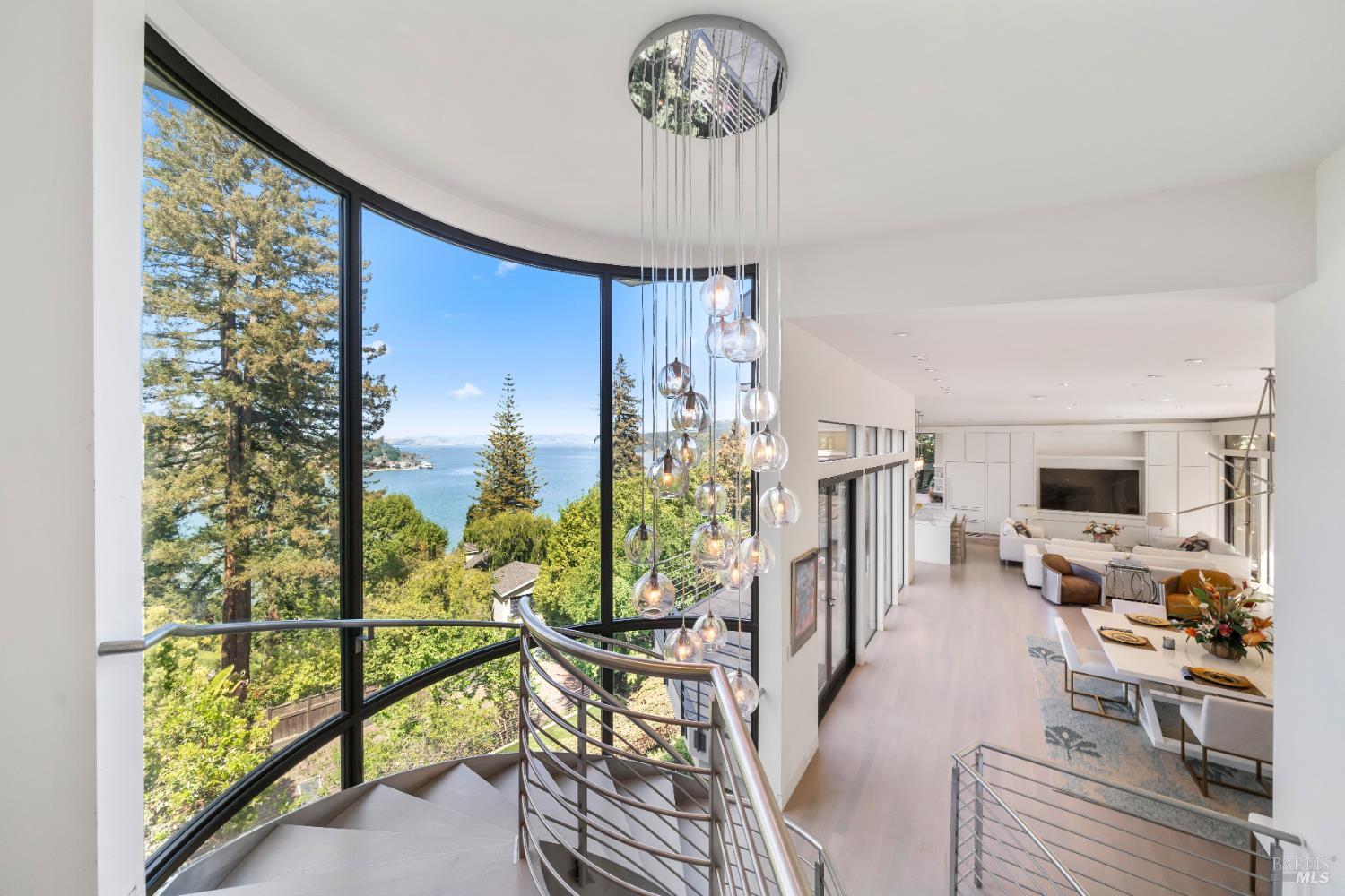 408 Golden Gate Avenue Belvedere, CA 94920 - Photo 4 of 71 a view of a dining room with furniture a chandelier and wooden floor