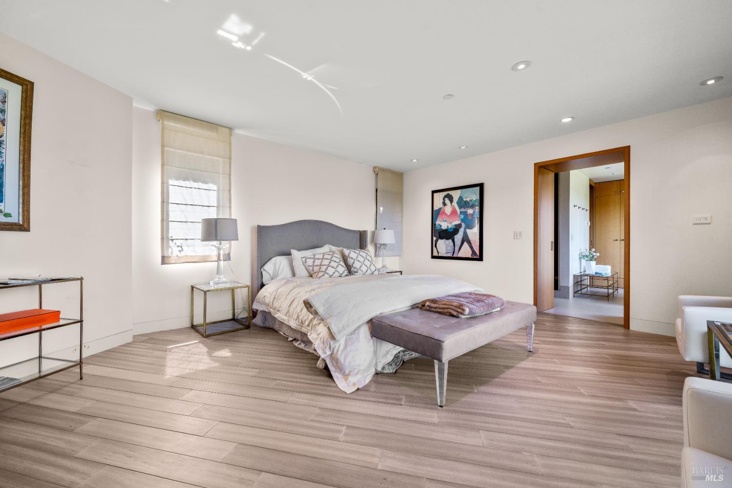 408 Golden Gate Avenue Belvedere, CA 94920 - Photo 43 of 71 a bedroom with a bed and wooden floor