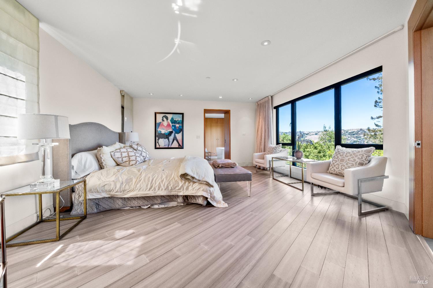 408 Golden Gate Avenue Belvedere, CA 94920 - Photo 44 of 71 a spacious bedroom with a bed couch and a large window