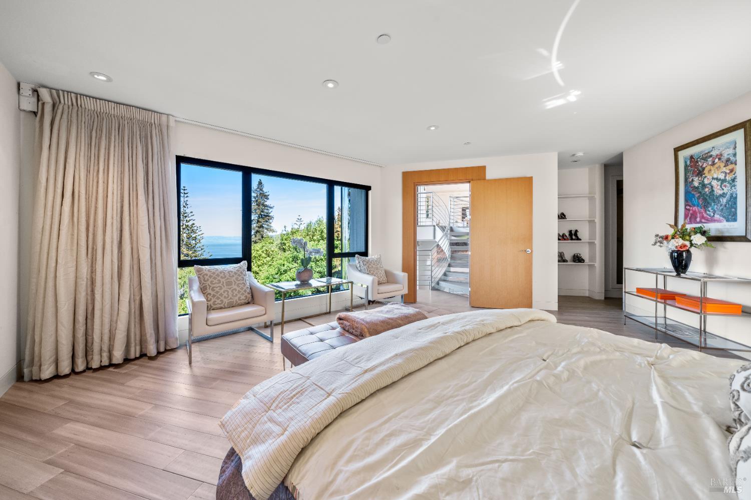 408 Golden Gate Avenue Belvedere, CA 94920 - Photo 45 of 71 a bedroom with a bed and large windows