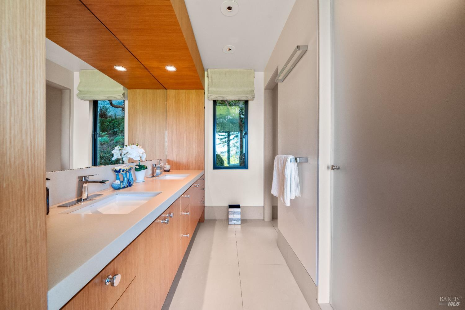 408 Golden Gate Avenue Belvedere, CA 94920 - Photo 47 of 71 a bathroom with a double vanity sink and mirror