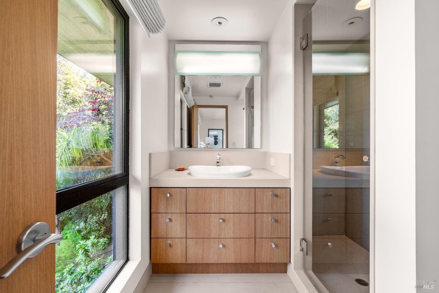 408 Golden Gate Avenue Belvedere, CA 94920 - Photo 54 of 71 a bathroom with a sink vanity and a mirror