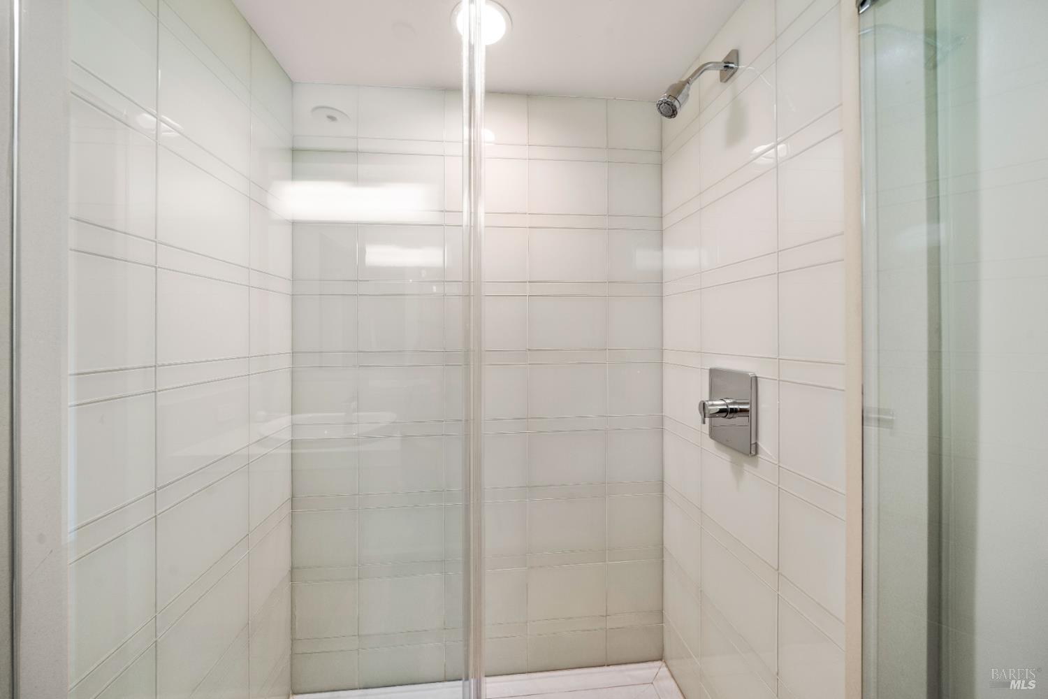 408 Golden Gate Avenue Belvedere, CA 94920 - Photo 58 of 71 a bathroom with a glass shower door