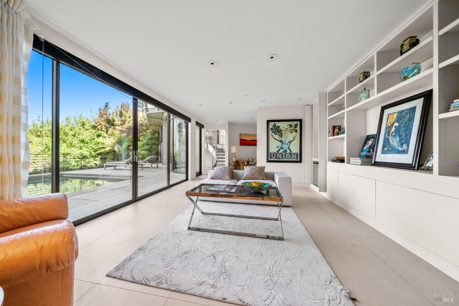 408 Golden Gate Avenue Belvedere, CA 94920 - Photo 61 of 71 a living room with furniture fireplace and a large window