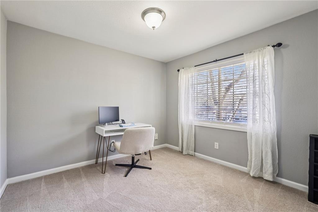 6940 Roswell Road, Unit A21 Atlanta, GA 30328 - Photo 16 of 25 a view of a workspace with furniture and a window
