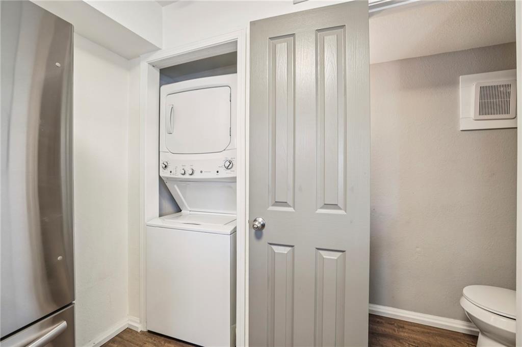 6940 Roswell Road, Unit A21 Atlanta, GA 30328 - Photo 19 of 25 a bathroom with a sink a toilet and shower