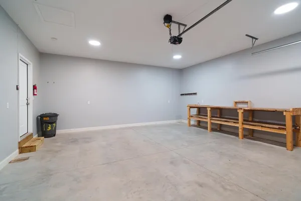 a kitchen with stainless steel appliances granite countertop a refrigerator stove microwave and sink