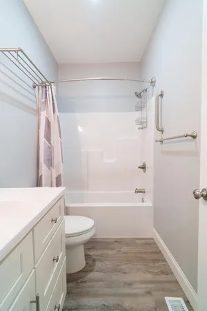 a bathroom with a shower and a bath tub