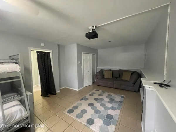 a bedroom with a bed and a mirror