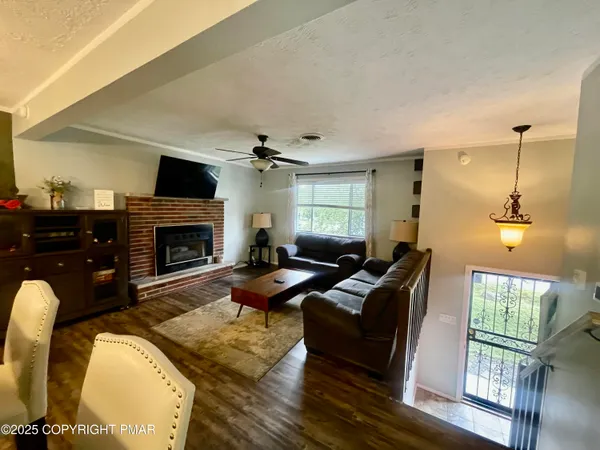 a living room with furniture fireplace and a flat screen tv