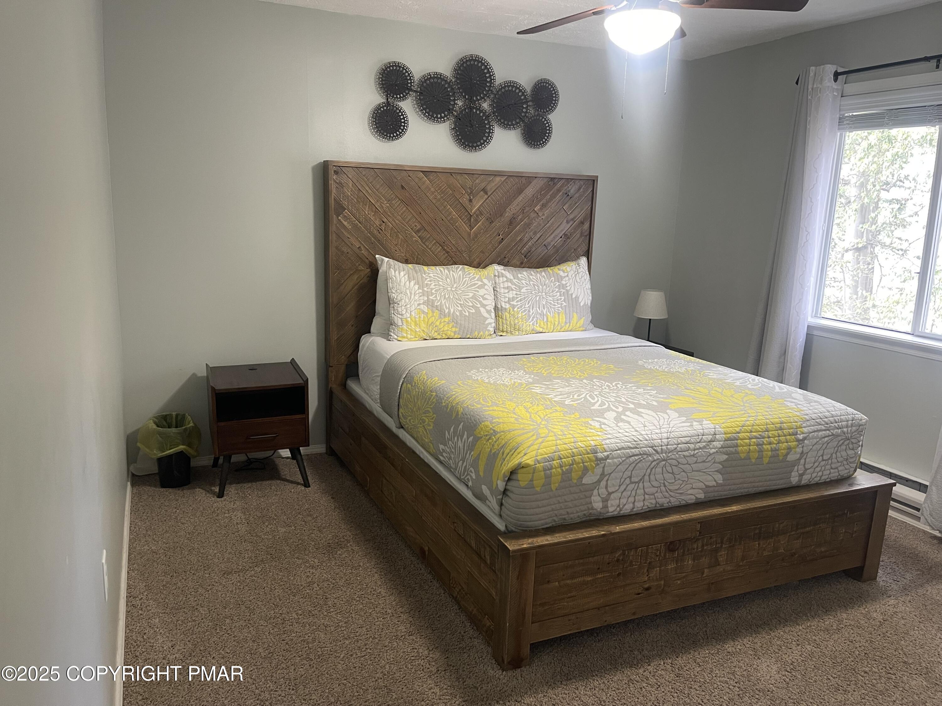 674 Country Pl Drive Tobyhanna, PA 18466 - Photo 6 of 17 a bed sitting in a bedroom next to a window