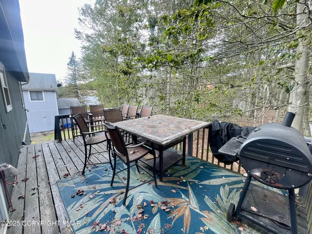 a view of a dinning table and chairs in patio