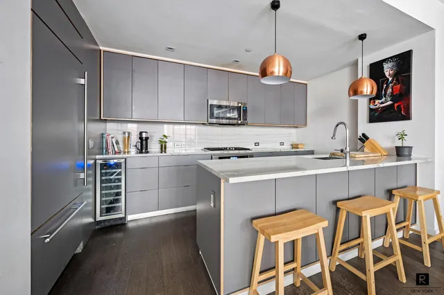 a view of a dining room with furniture and a potted plant