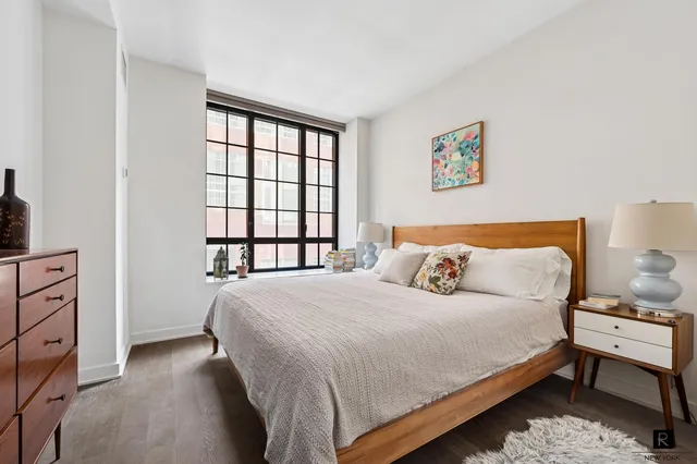 a bathroom with a double vanity sink a toilet and a mirror