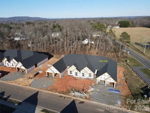 an aerial view of a house with a ocean view