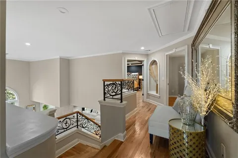 a bedroom with a bed a couch and a window