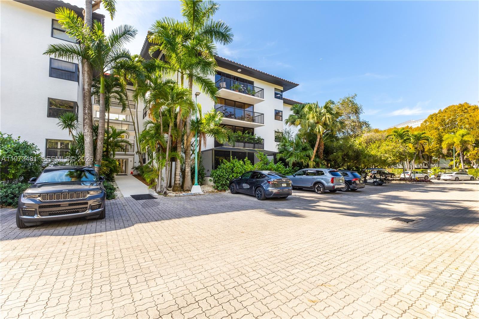 101 Ocean Ln Drive, Unit 1012 Key Biscayne, FL 33149 - Photo 28 of 39 a view of a street with a cars parked in front of it