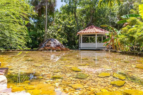 a view of a swimming pool with an outdoor seating