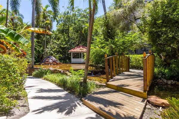 a view of a backyard with sitting area