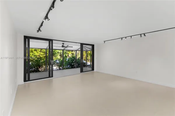a view of an empty room with a sliding door