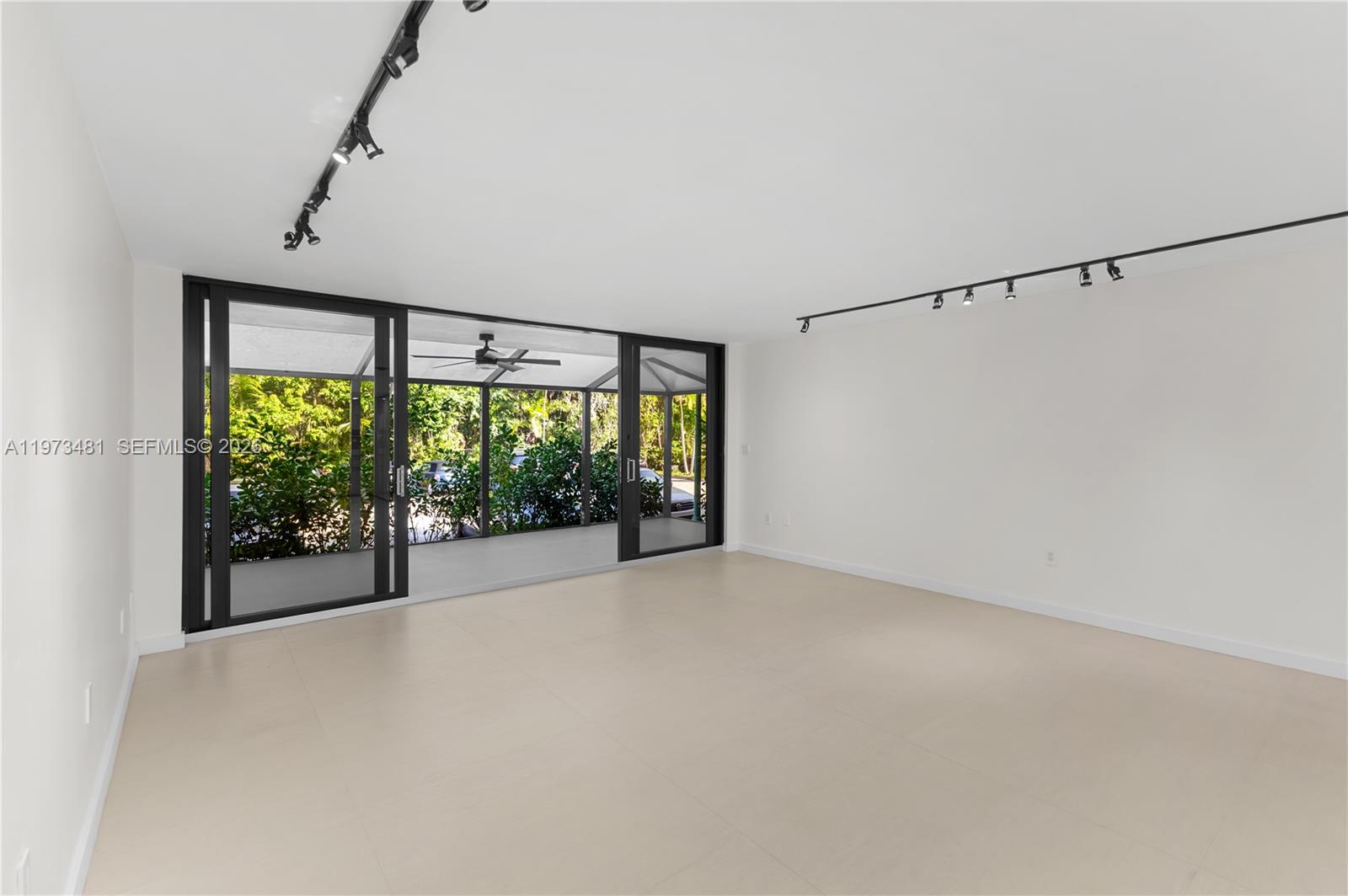 101 Ocean Ln Drive, Unit 1012 Key Biscayne, FL 33149 - Photo 8 of 39 a view of an empty room with a sliding door