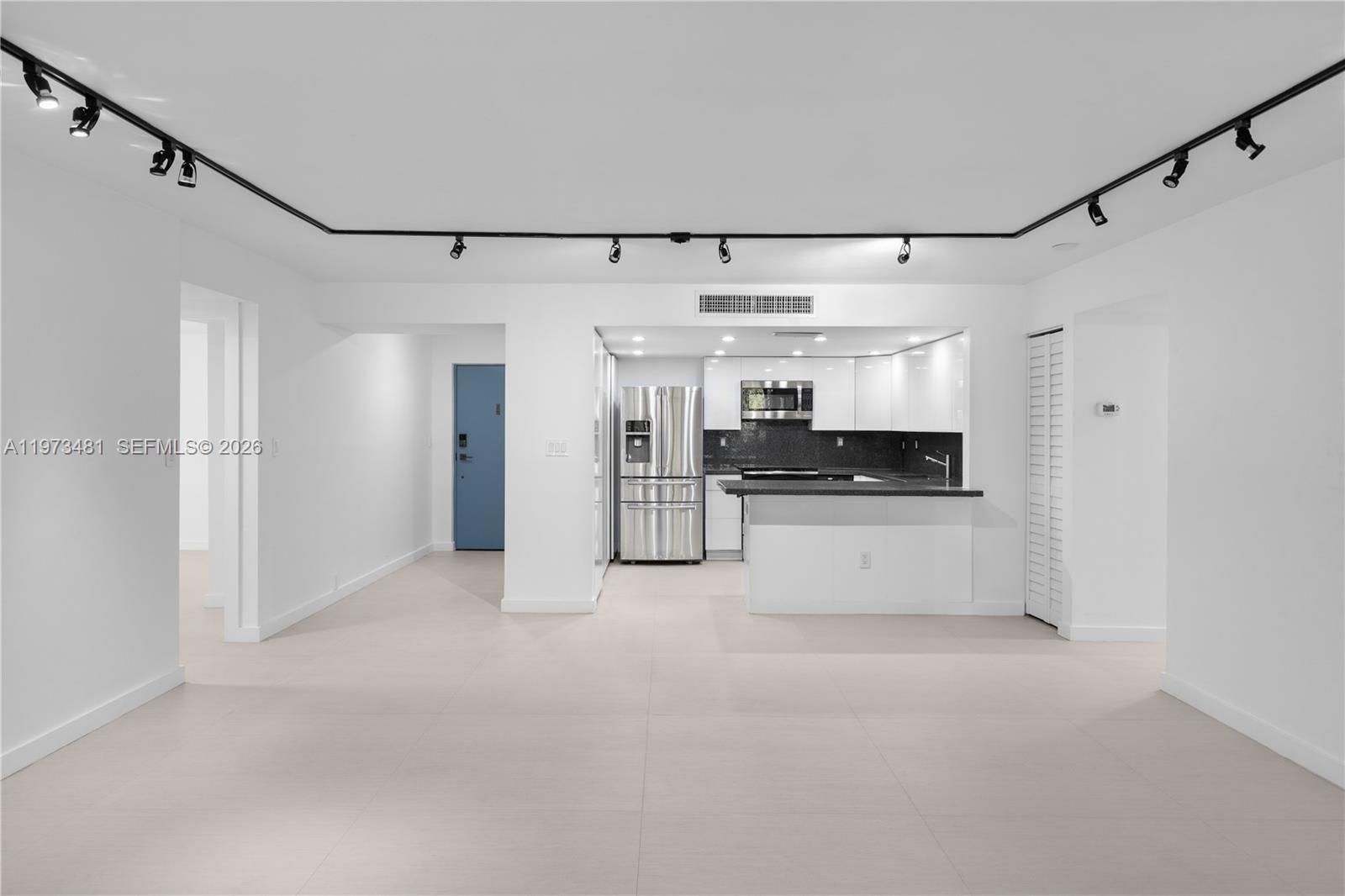 101 Ocean Ln Drive, Unit 1012 Key Biscayne, FL 33149 - Photo 10 of 39 a view of a big room with stainless steel appliances kitchen island granite countertop a refrigerator and a sink