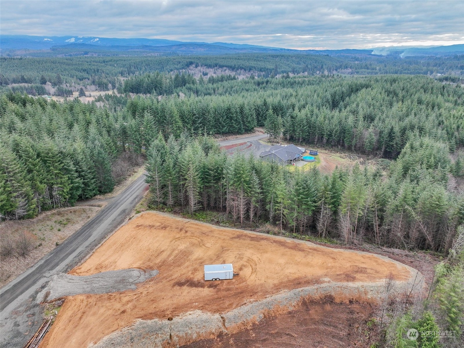255 Arrowhead Drive Elma, WA 98541 - Photo 17 of 20 a view of a forest with a yard