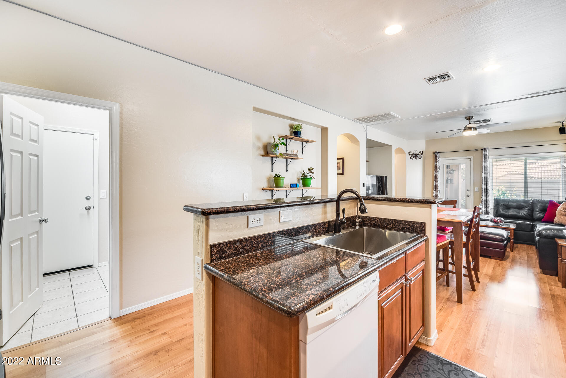 1868 South Rome Street Gilbert, AZ 85295 - Photo 12 of 34 a kitchen with a stove a sink and a refrigerator