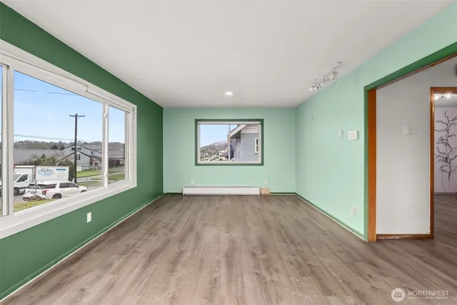 a view of an empty room with glass door