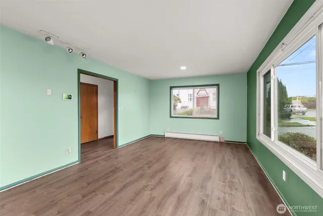 a kitchen with a sink a stove and cabinets
