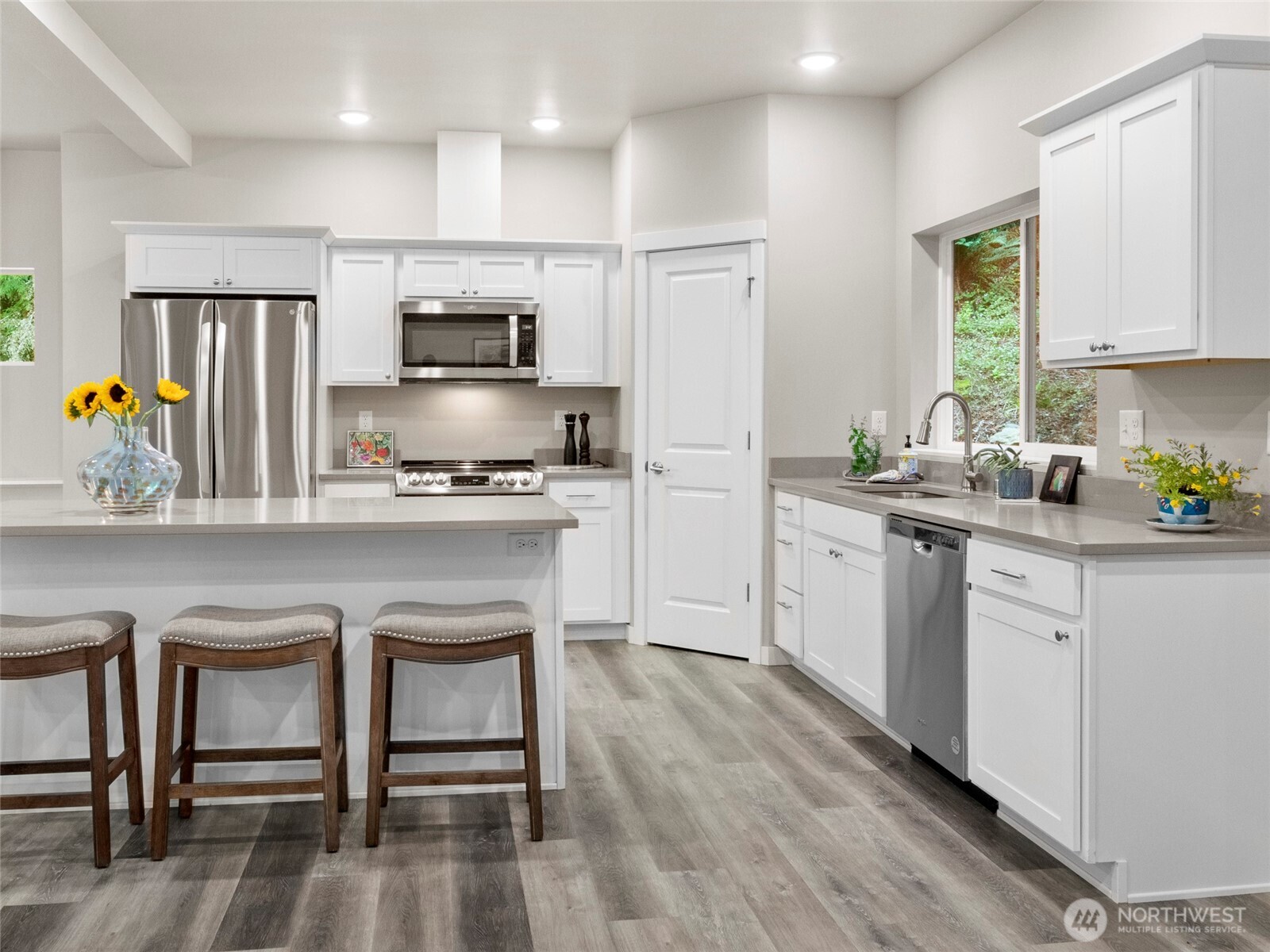 38 Harborview Drive Bellingham, WA 98229 - Photo 12 of 39 a kitchen with a sink cabinets and stainless steel appliances