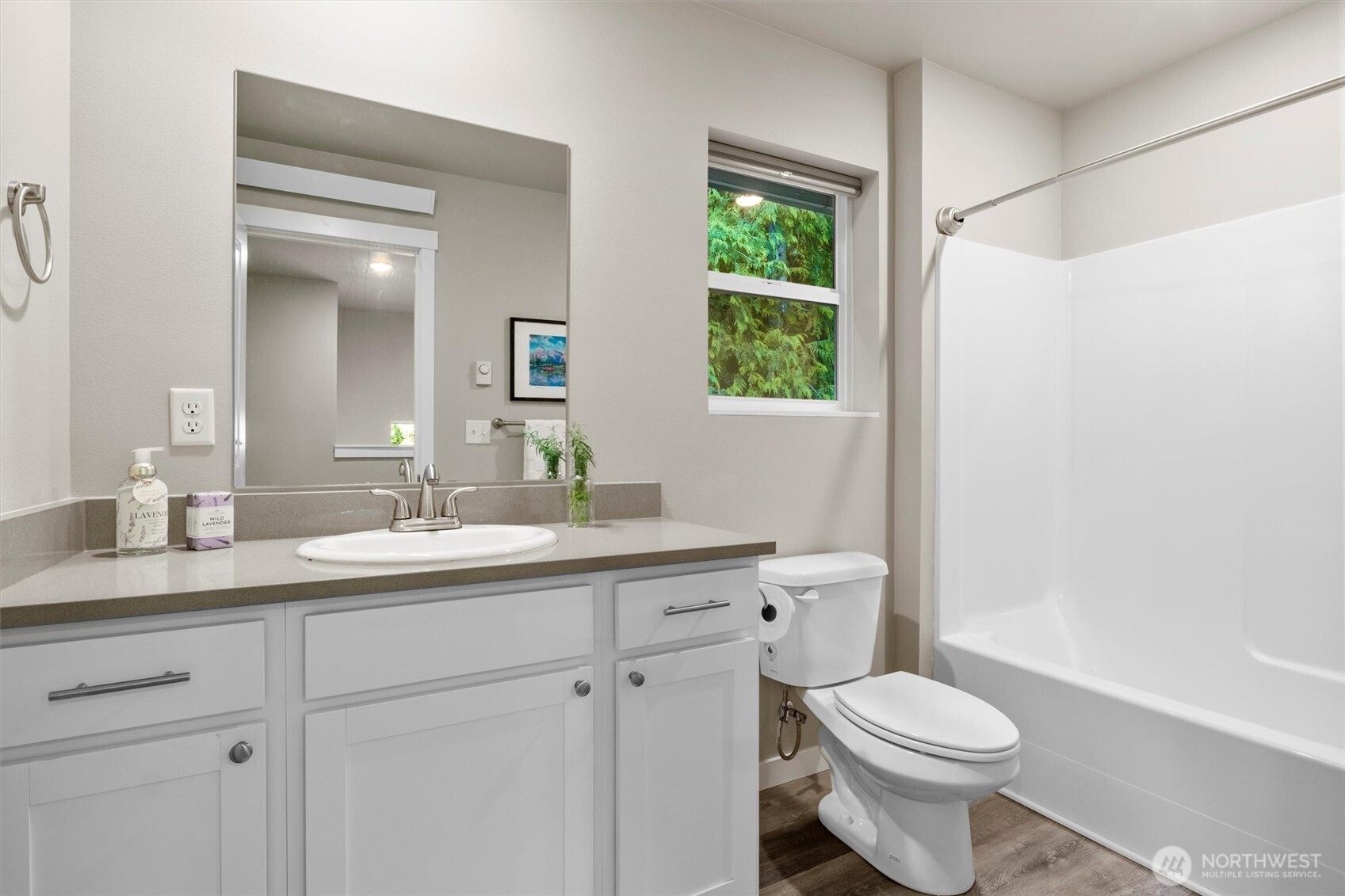 38 Harborview Drive Bellingham, WA 98229 - Photo 35 of 39 a bathroom with a toilet a sink a vanity and mirror