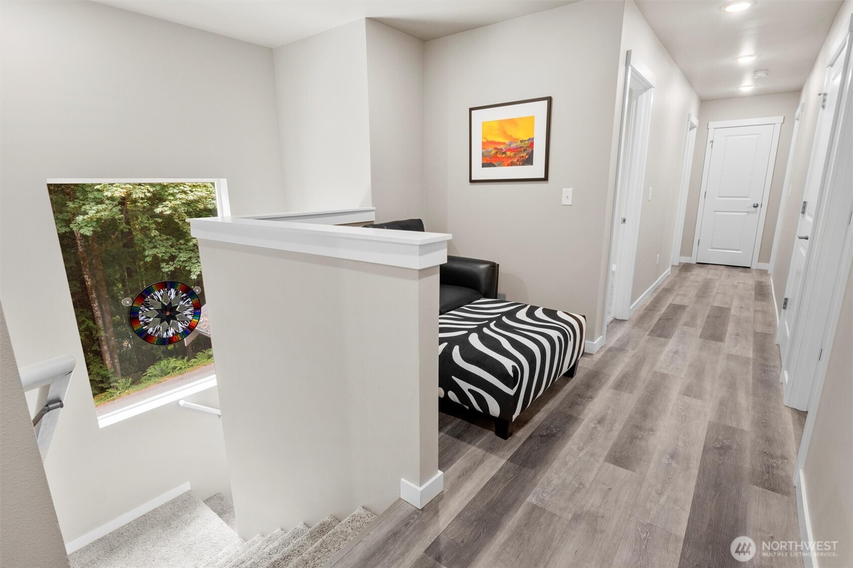 38 Harborview Drive Bellingham, WA 98229 - Photo 37 of 39 a bedroom with a bed and a painting on the wall